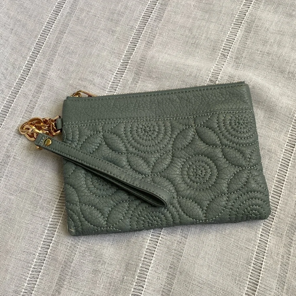 Deux Lux quilted wristlet with gold embellishments.